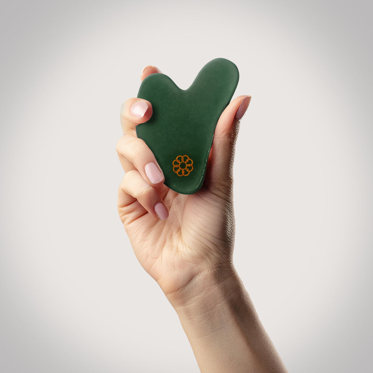 8 Elements Jade Gua Sha in Hand
