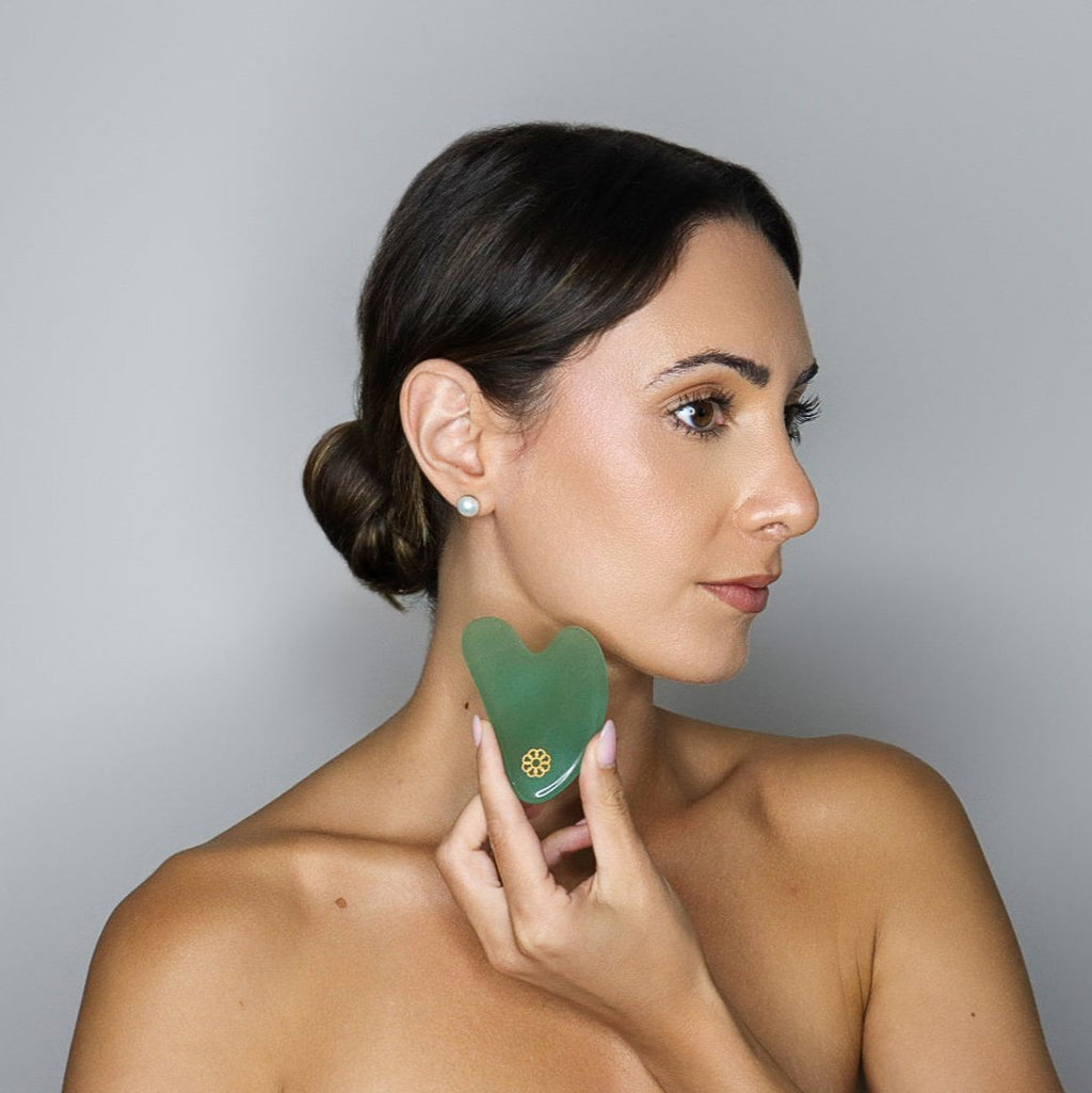 8 Elements Jade Gua Sha in hand 